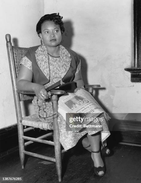 American civil rights activist Mamie Till , the mother of Emmett Till, sitting with a copy of the Clarion-Ledger newspaper on her lap, in Sumner,...