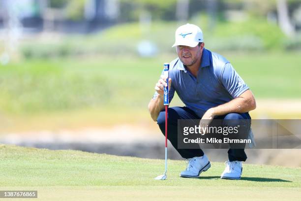 Robert Garrigus of the United States lines up a putt on the 18th green during the second round of the Corales Puntacana Championship at the Corales...