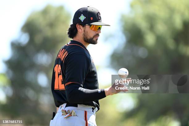 Alex Blandino of the San Francisco Giants juggles a baseball while warming up prior to a spring training game against the Chicago White Sox at...