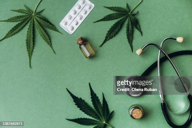 cannabis, pills, thc oil and stethoscope. - marijuana stock pictures, royalty-free photos & images