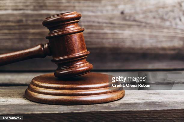 gavel over sound block on planks. - trial stock pictures, royalty-free photos & images