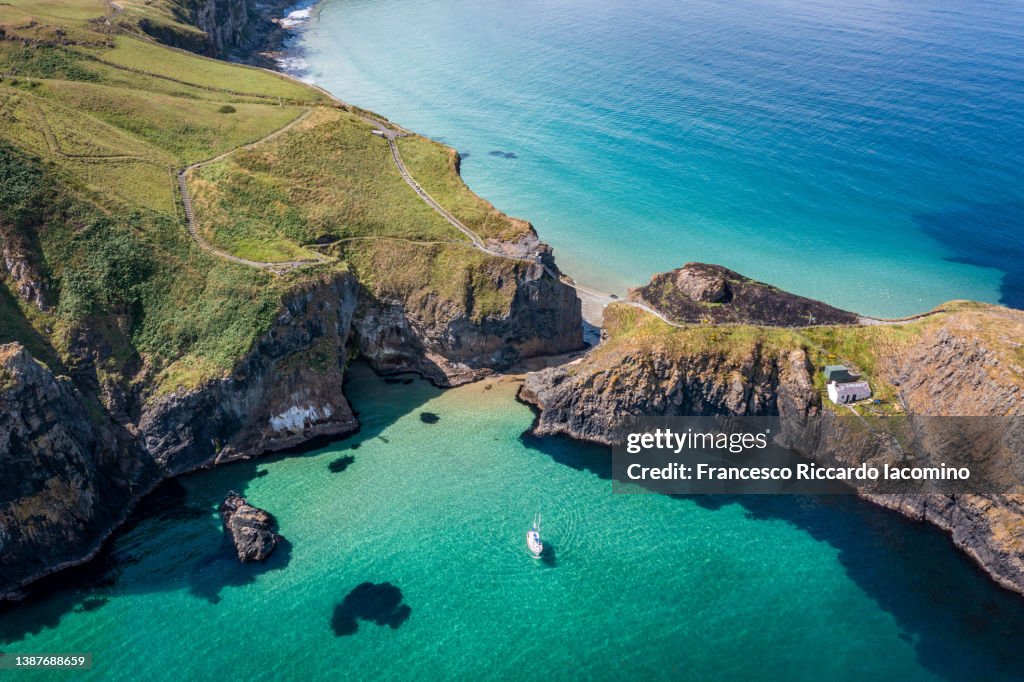 UK, Northern Ireland, County Antrim, Ballintoy, Carrick-a-Rede Rope Bridge, Aerial Drone view