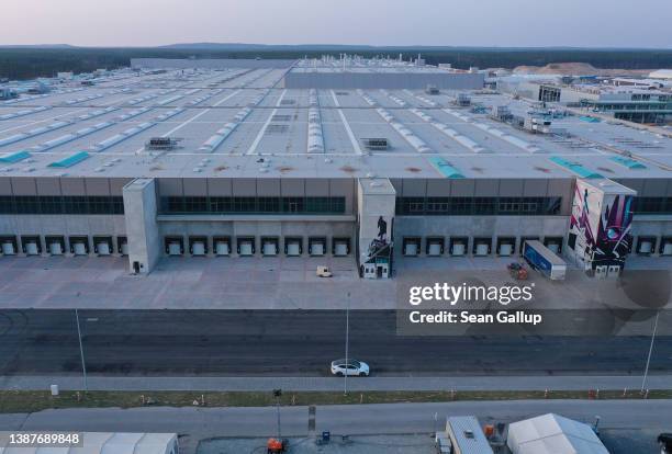 In this aerial view the new Tesla Gigafactory electric car manufacturing plant stands on March 25, 2022 near Gruenheide, Germany. The new plant,...