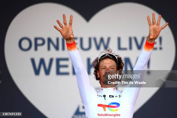 Daniel Oss of Italy and Team Total Energies celebrates winning the trophy for the most combative rider on the podium ceremony after the 65th E3 Saxo...