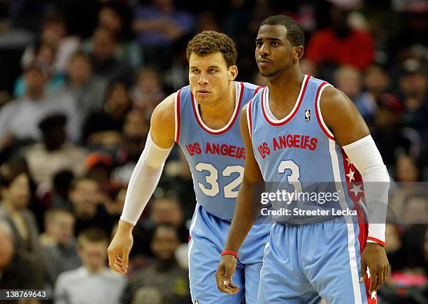 Blake Griffin of the Los Angeles Clippers and teammate Chris Paul prepare to play defense against the Charlotte Bobcats during their game at Time...