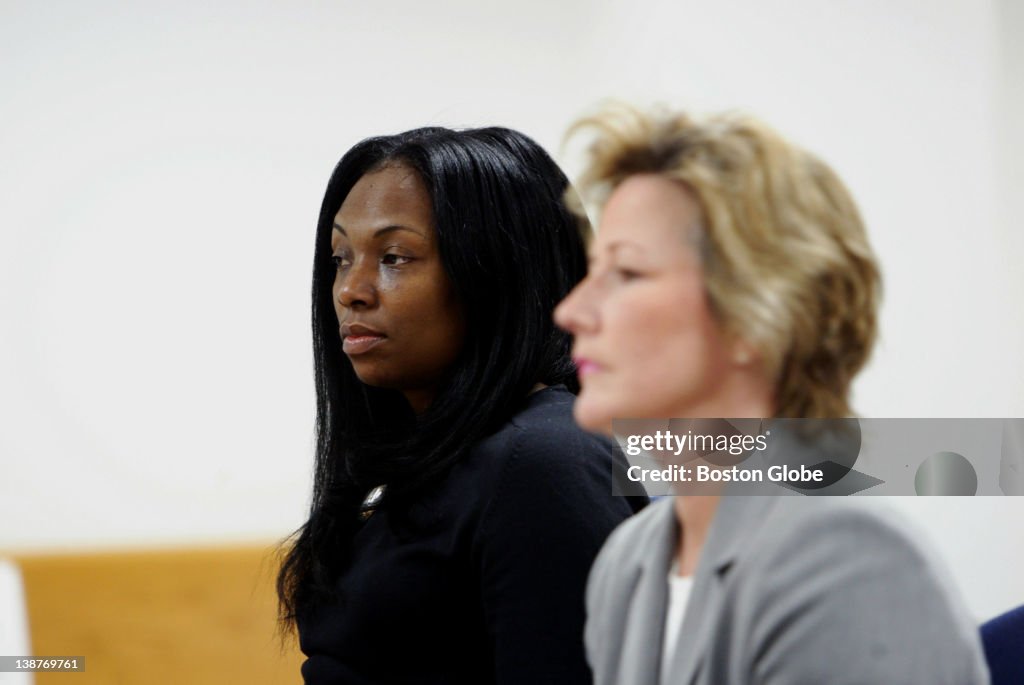 Kim Ward, left, the mother of Bobby Brown's two children, stands