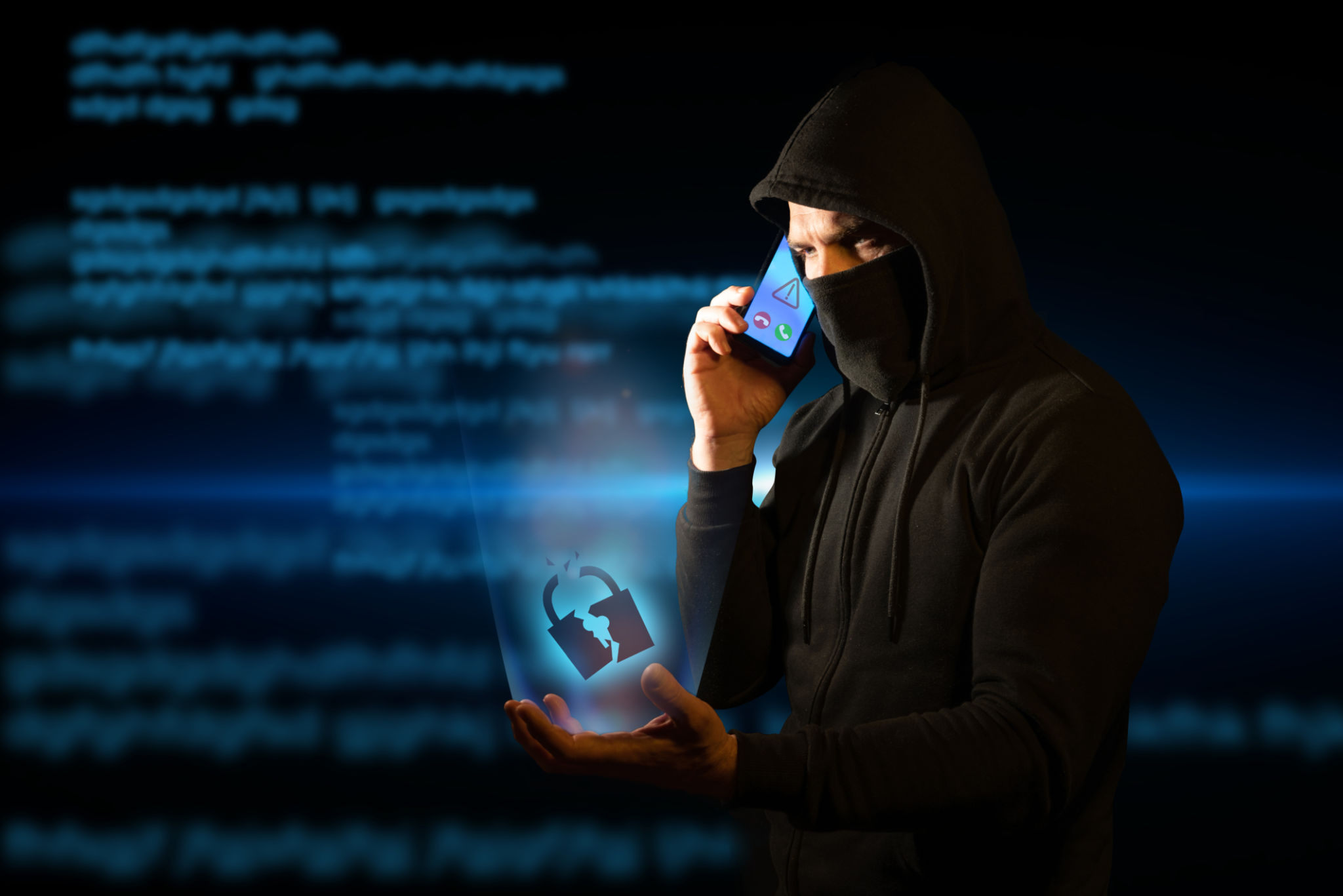 Scammer telephoning his victims while holding a broken padlock in his hand symbolizing breached security. Concept of vishing Scammer telephoning his victims while holding a broken padlock in his hand symbolizing breached security. Concept of vishing