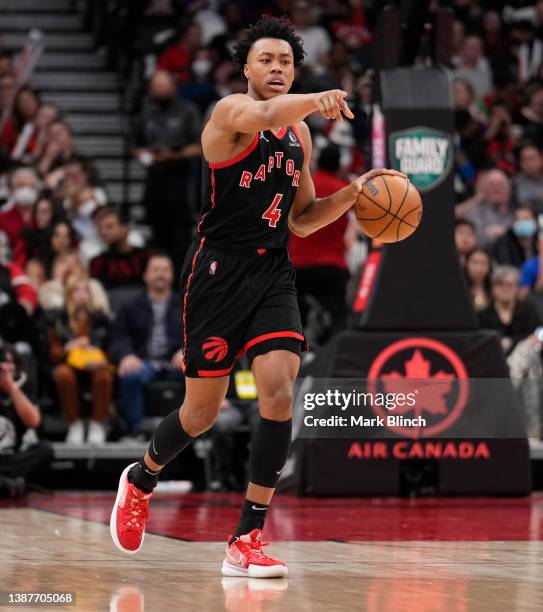 Scottie Barnes of the Toronto Raptors dribbles against the Cleveland Cavaliers during the second half of their basketball game at the Scotiabank...