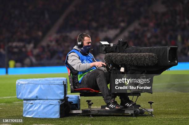 Television cameraman with a face covering at wor during the international friendly match between Scotland and Poland at Hampden Park on March 24,...