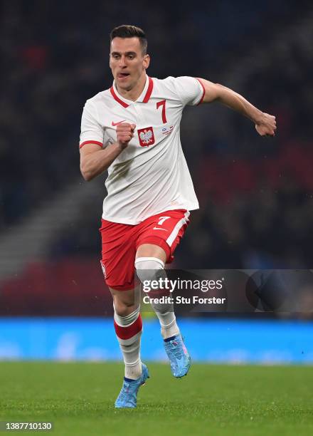 Poland player Arkadiusz Milik in action during the international friendly match between Scotland and Poland at Hampden Park on March 24, 2022 in...