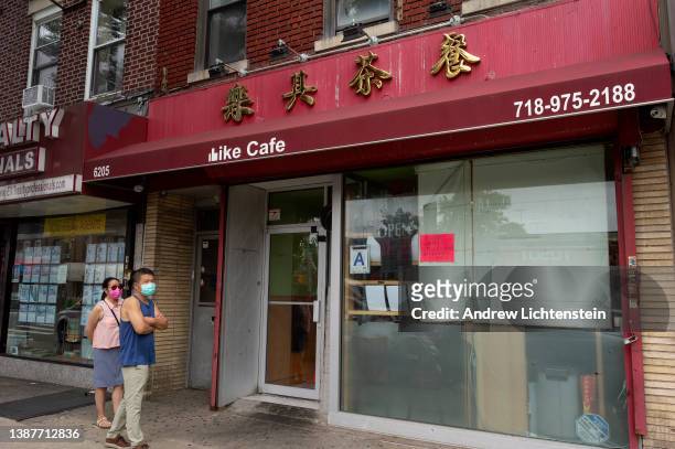 Pedestrians walk past a Chinese restaurant on July 11, 2021 in the Bensonhurst neighborhood of Brooklyn, New York City. What was once Tali's bar,...