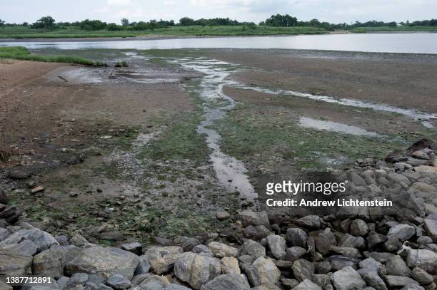 Water at low tide extends out to the bay next to a former trash dump that is now Shirley Chisholm State Park, on July 10, 2021 in the East New York...