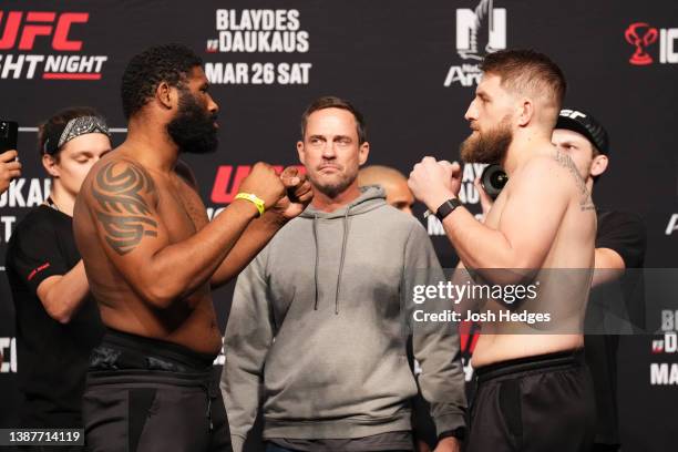 Curtis Blaydes and Chris Daukaus face off during the UFC Fight Night ceremonial weigh-in at Nationwide Arena on March 25, 2022 in Columbus, Ohio.