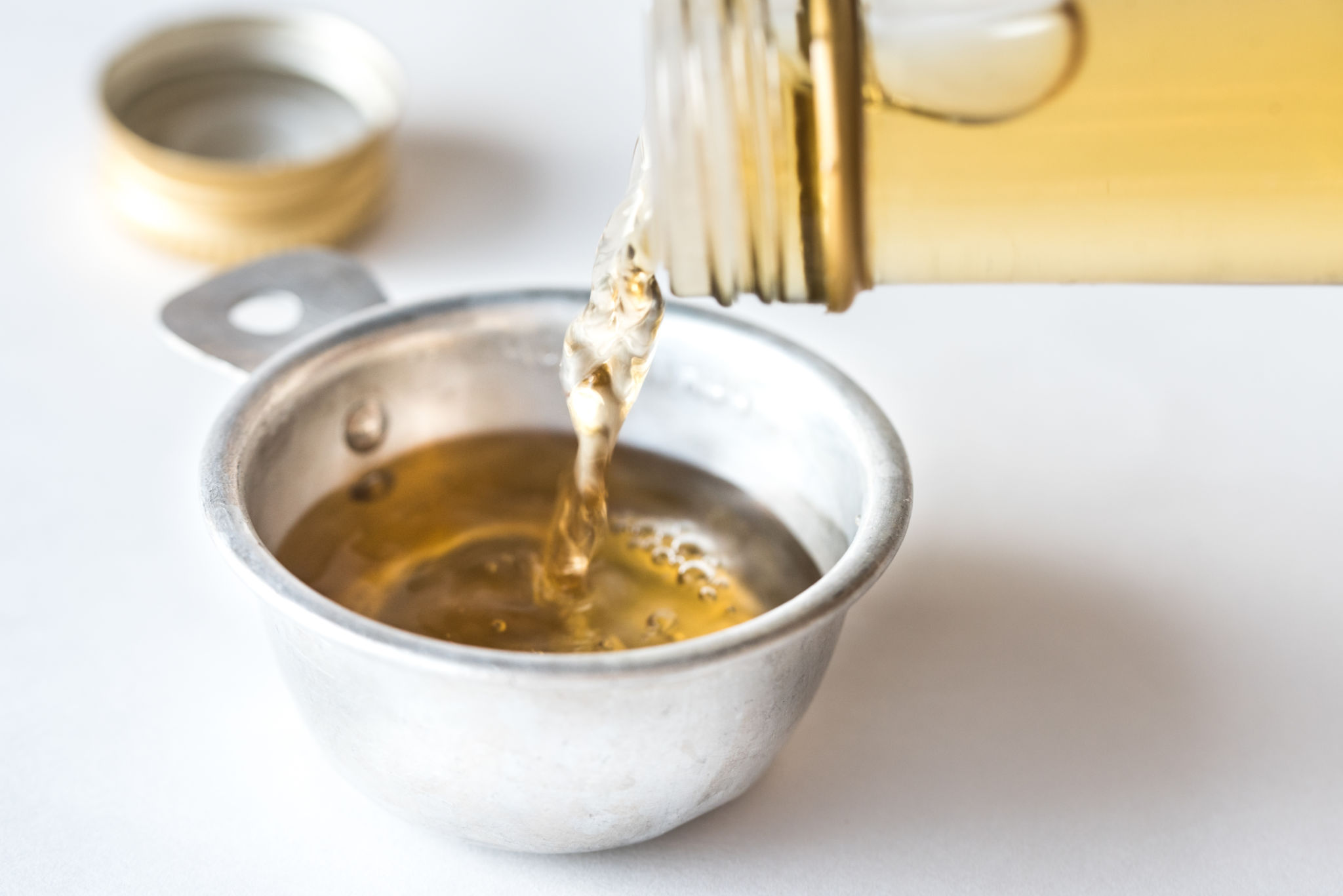 pouring vinegar drain