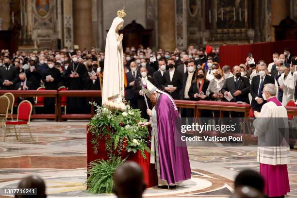 Pope Francis prays at the feet of Our Lady of Fatima during the annual “24 Hours for the Lord” Lenten penitential service in St. Peter’s Basilica as...