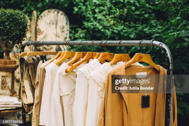 clothes on a hanger - designerkleding stockfoto's en -beelden