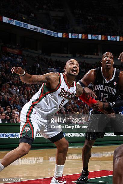 Drew Gooden of the Milwaukee Bucks battles for position against Dwight Howard of the Orlando Magic during the game on February 11, 2012 at the...