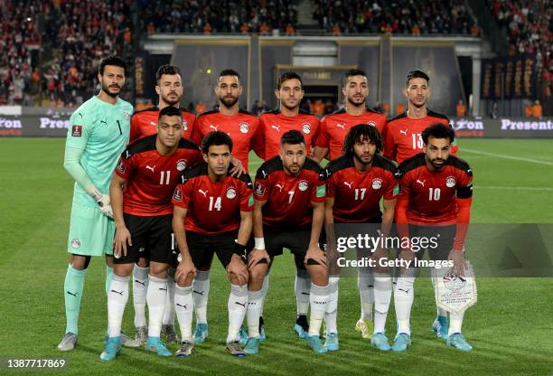 The Egypt team lines up ahead of the FIFA World Cup Qatar 2022 qualification match between Egypt and Senegal at Cairo International Stadium on March...