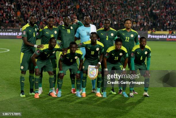 The Senegal team lines up ahead of the FIFA World Cup Qatar 2022 qualification match between Egypt and Senegal at Cairo International Stadium on...