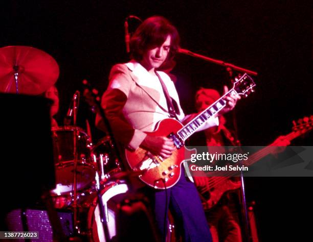 English guitarist, singer and songwriter Dave Davies, of the English rock band The Kinks, plays during a concert on February 19, 1977 at the...