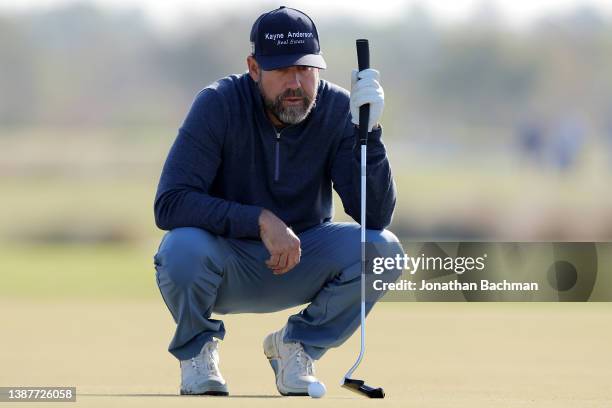 Eric Compton studies a putt on the third green during the second round of the Lake Charles Championship at Country Club at Golden Nugget on March 25,...