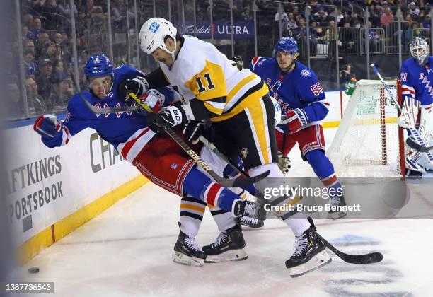 Brian Boyle of the Pittsburgh Penguins steps into Jonny Brodzinski of the New York Rangers during the first period at Madison Square Garden on March...