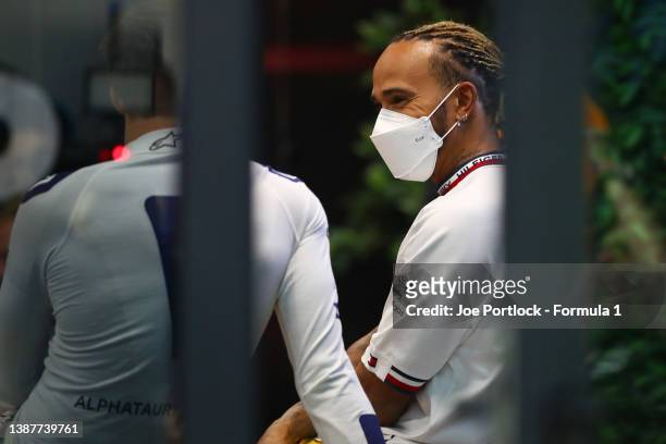 Lewis Hamilton of Great Britain and Mercedes speaks with Pierre Gasly of France and Scuderia AlphaTauri during a meeting attended by all of the...