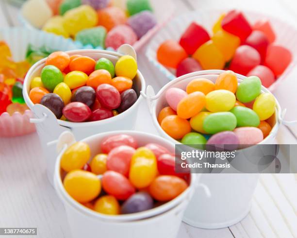 assortment of colorful jelly bean candy - bowl of candy stock-fotos und bilder