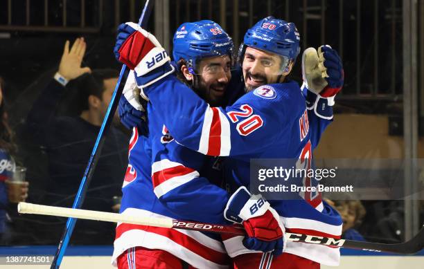 Chris Kreider of the New York Rangers celebrates his second period goal against the Pittsburgh Penguins and is joined by Mika Zibanejad at Madison...