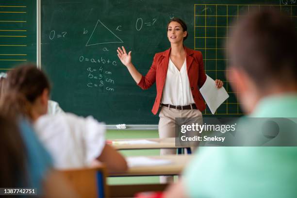 teacher questioning class. - math tutor stock pictures, royalty-free photos & images