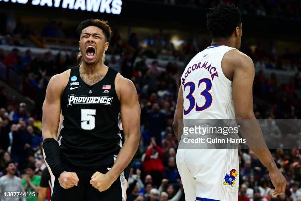 Ed Croswell of the Providence Friars celebrates after a basket against the Kansas Jayhawks during the second half in the Sweet Sixteen round game of...