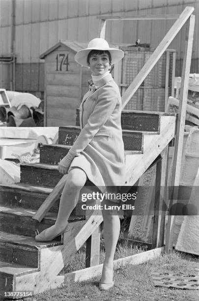 British actress Jacqueline Pearce posing outside Shepperton Studios, where she is filming the Jerry Paris comedy 'Don't Raise The Bridge, Lower The...