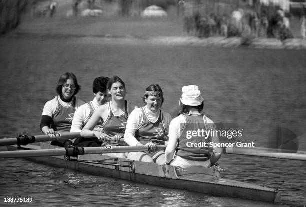 Boston University women's crew team practice on the Charles River, Boston, Massachusetts, 1975.