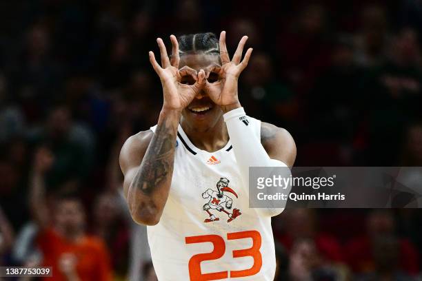 Kameron McGusty of the Miami Hurricanes celebrates after a three-point basket against the Iowa State Cyclones during the first half in the Sweet...
