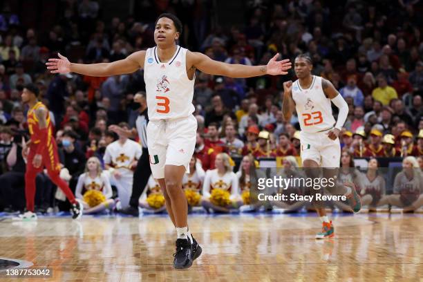 Charlie Moore and Kameron McGusty of the Miami Hurricanes celebrate a play against the Iowa State Cyclones during the first half in the Sweet Sixteen...