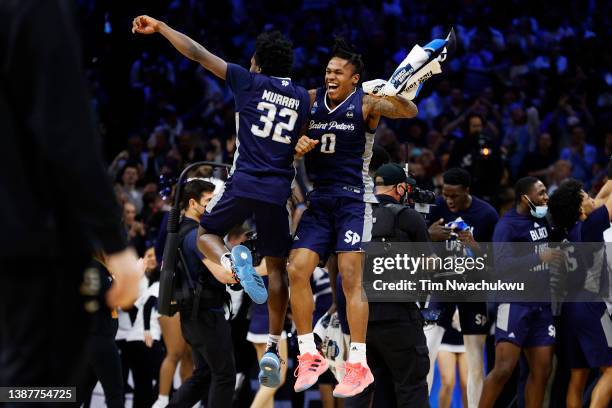 Jaylen Murray and Latrell Reid of the St. Peter's Peacocks celebrate after defeating the Purdue Boilermakers 67-64 in the Sweet Sixteen round game of...