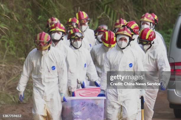 Rescuers work at the site of a plane crash on March 25, 2022 in Tengxian County, Wuzhou City, Guangxi Zhuang Autonomous Region of China. A China...
