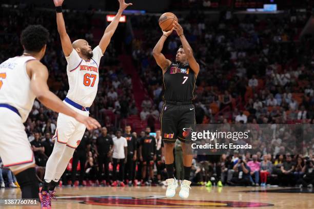 Kyle Lowry of the Miami Heat shoots a three point shot during the second half agains the New York Knicks at FTX Arena on March 25, 2022 in Miami,...