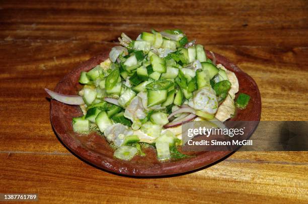 aguachile de camarón (shrimp aguachile ceviche with cucumber, red onion, cilantro, lime juice and green oil) - cultura guatemalteca imagens e fotografias de stock