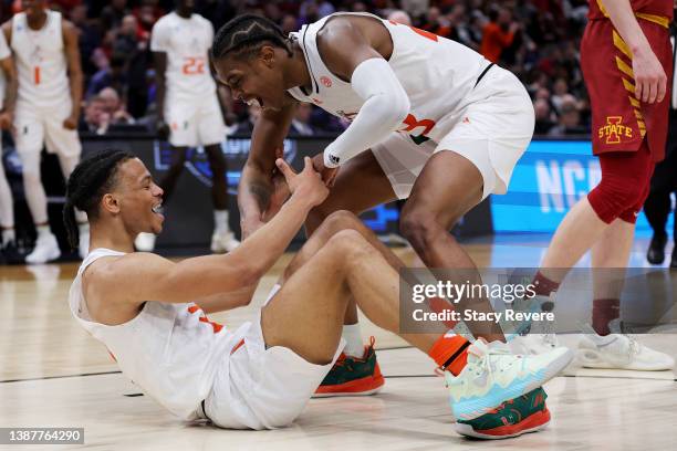 Isaiah Wong and Kameron McGusty of the Miami Hurricanes celebrate after a play against the Iowa State Cyclones during the second half in the Sweet...