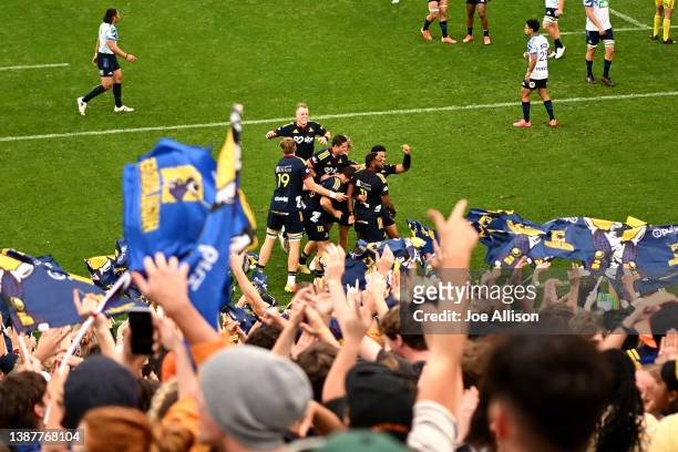 The Highlanders celebrate a tru that was later disallowed during the round six Super Rugby Pacific match between the Highlanders and the Blues at...