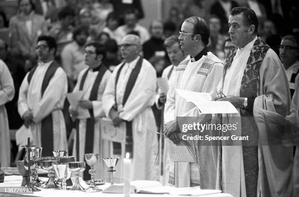 Catholic priests prepare for a Mass at Boston College in Chestnut Hill, Boston, Massachusetts, 1970.