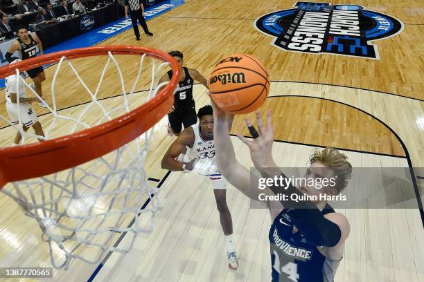 Noah Horchler of the Providence Friars shoots the ball against David McCormack of the Kansas Jayhawks during the second half in the Sweet Sixteen...