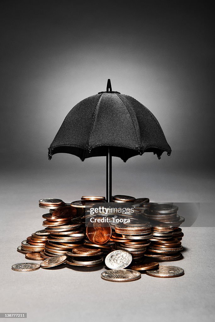 Umbrella over coins