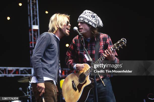 Taylor Hawkins and Dave Grohl of the Foo Fighters perform as part of the Bridge School Benefit 2000 at Shoreline Amphitheatre on October 29, 2000 in...