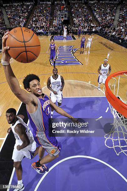 Josh Childress of the Phoenix Suns dunks the ball past Donte Greene of the Sacramento Kings on February 11, 2012 at Power Balance Pavilion in...
