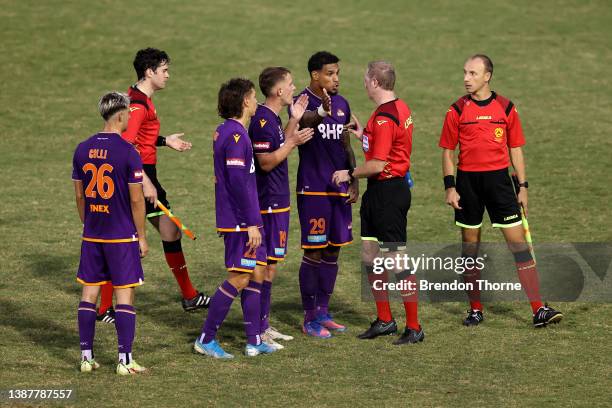 Glory players speak with referee Kurt Ams at full time during the A-League Mens match between Wellington Phoenix and Perth Glory at Leichhardt Oval,...