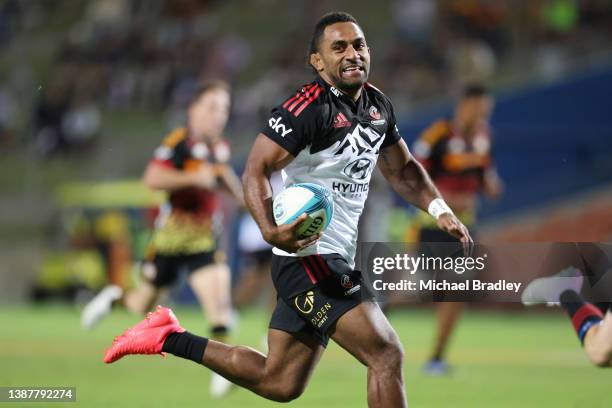 Sevu Reece of the Crusaders runs away for a try during the round six Super Rugby Pacific match between the Chiefs and the Crusaders at FMG Stadium...