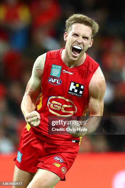 Noah Anderson of the Suns celebrates a goalduring the round two AFL match between the Gold Coast Suns and the Melbourne Demons at Metricon Stadium on...