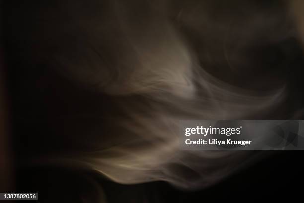 smoke texture on black background. - smoking hot stock pictures, royalty-free photos & images